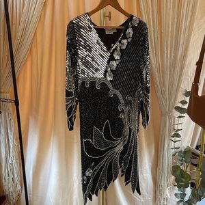 Vintage 1980s art deco with 1920s flapper flare dress by MAHARAJ. Silk beaded